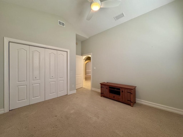 5672 Burnside Cir, Tallahassee, FL 32312 - unfurnished bedroom featuring carpet floors, a closet, arched walkways, ceiling fan, and high vaulted ceiling