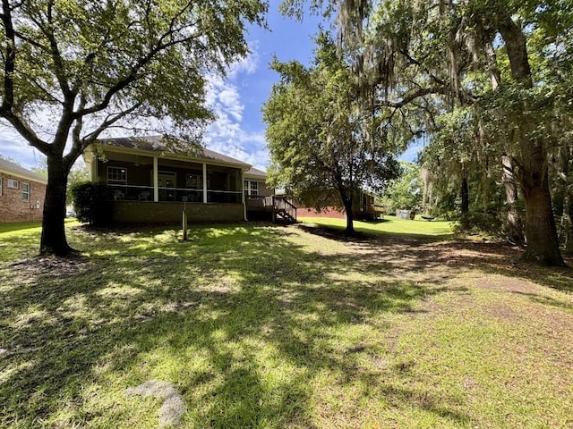 5672 Burnside Cir, Tallahassee, FL 32312 - view of grassy yard featuring a deck