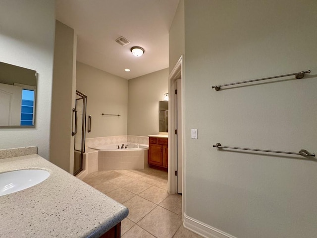 5672 Burnside Cir, Tallahassee, FL 32312 - bathroom with two vanities, tile patterned floors, a bath, and a shower stall
