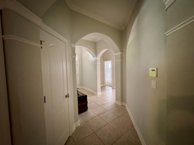 5672 Burnside Cir, Tallahassee, FL 32312 - hallway featuring arched walkways, tile patterned flooring, crown molding, and decorative columns