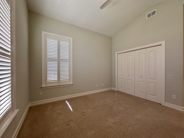 5672 Burnside Cir, Tallahassee, FL 32312 - unfurnished bedroom featuring carpet, lofted ceiling, a closet, and ceiling fan