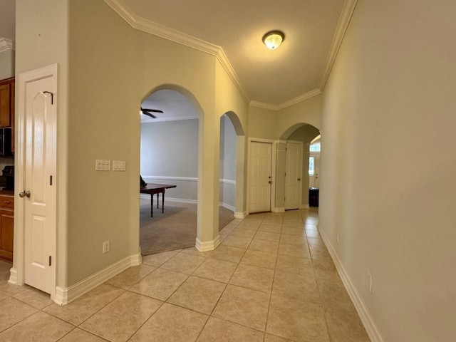 5672 Burnside Cir, Tallahassee, FL 32312 - hall featuring ornamental molding, arched walkways, and light tile patterned floors
