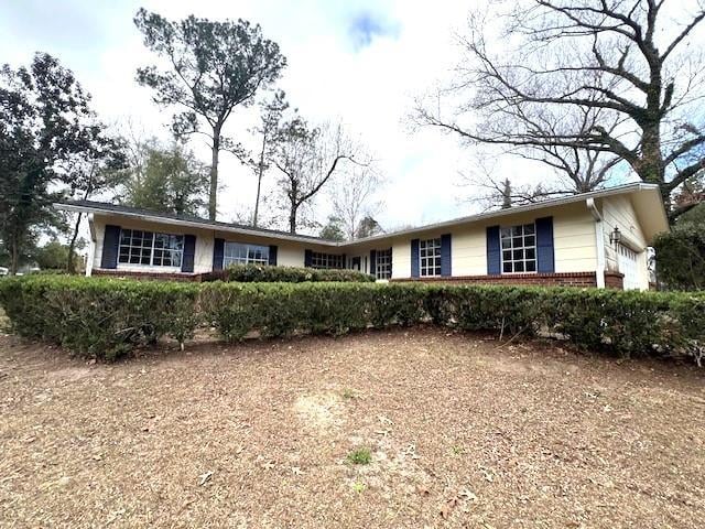 single story home with a garage