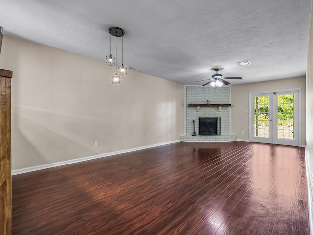 2600 Panther Creek Rd Unit A, Tallahassee, FL 32308 - unfurnished living room with a ceiling fan, dark wood-style floors, and a brick fireplace