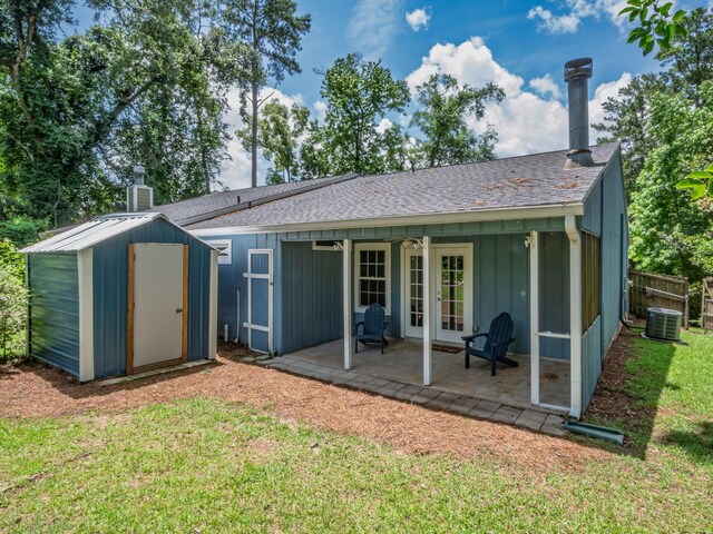 2600 Panther Creek Rd Unit A, Tallahassee, FL 32308 - back of property with french doors, a patio area, a chimney, a storage unit, and board and batten siding