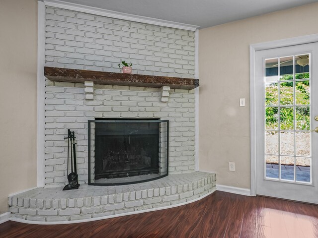 2600 Panther Creek Rd Unit A, Tallahassee, FL 32308 - detailed view of wood finished floors, a brick fireplace, and ornamental molding