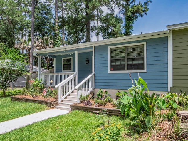 2600 Panther Creek Rd Unit A, Tallahassee, FL 32308 - view of front of property featuring a porch and a front yard