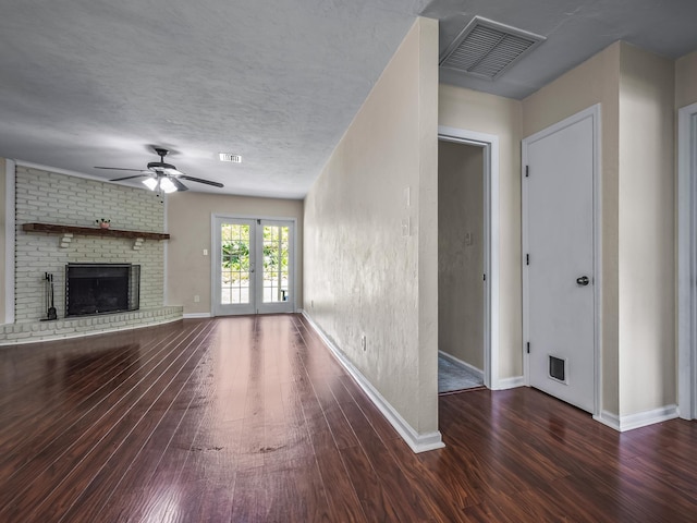 2600 Panther Creek Rd Unit A, Tallahassee, FL 32308 - unfurnished living room with wood finished floors, a ceiling fan, and a brick fireplace