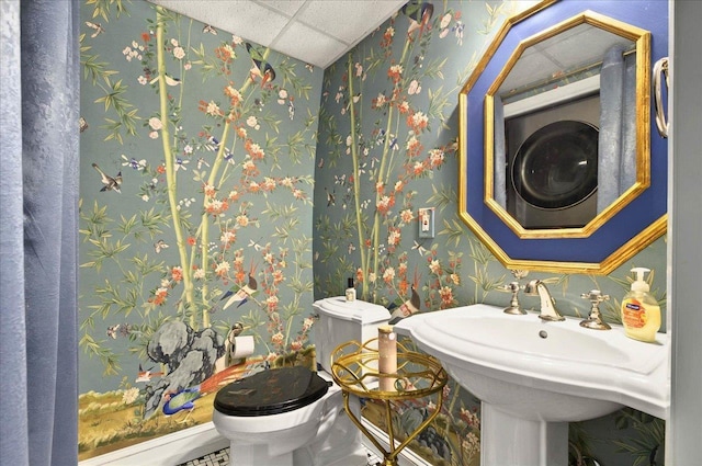 1645 Tallavana Trl, Havana, FL 32333 - half bathroom featuring wallpapered walls, toilet, a drop ceiling, and a sink