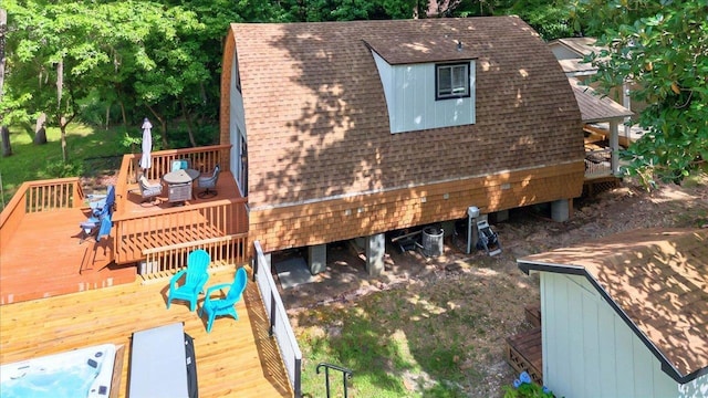 1645 Tallavana Trl, Havana, FL 32333 - view of side of home with outdoor dining space, a shingled roof, and a wooden deck