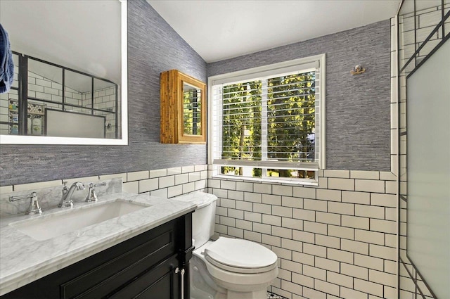 1645 Tallavana Trl, Havana, FL 32333 - bathroom featuring toilet, plenty of natural light, tile walls, vanity, and a shower