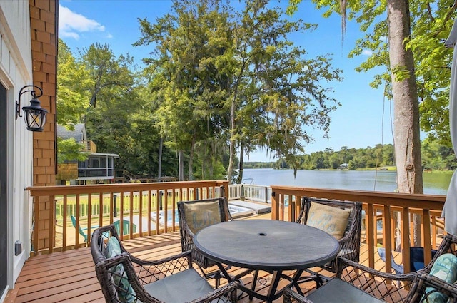 1645 Tallavana Trl, Havana, FL 32333 - deck with outdoor dining space, a water view, and view of wooded area