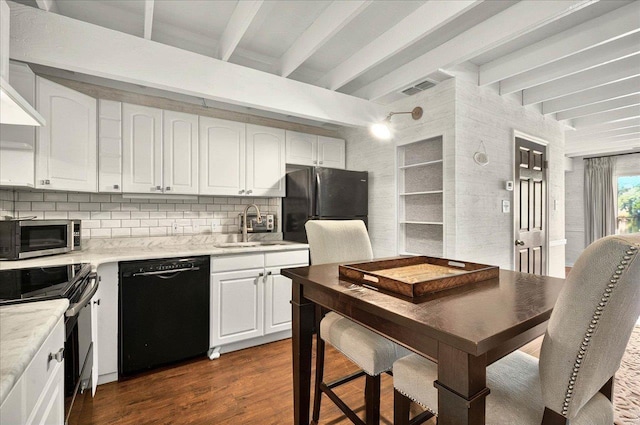 1645 Tallavana Trl, Havana, FL 32333 - kitchen featuring black dishwasher, stainless steel microwave, a sink, beamed ceiling, and freestanding refrigerator