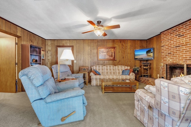 living room featuring a textured ceiling, a brick fireplace, light colored carpet, and ceiling fan