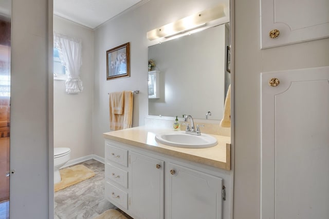 bathroom with toilet and vanity