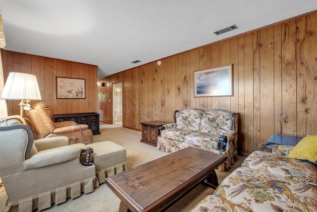 living room featuring light colored carpet and wood walls