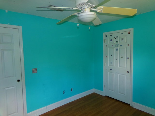 402 W Brent St, Chattahoochee, FL 32324 - unfurnished bedroom featuring dark wood-style floors and a ceiling fan