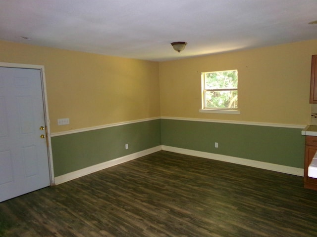 402 W Brent St, Chattahoochee, FL 32324 - empty room featuring dark wood-style flooring and baseboards