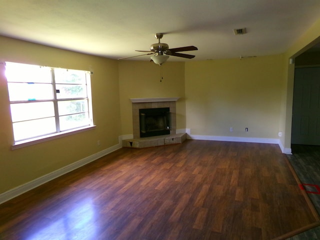 402 W Brent St, Chattahoochee, FL 32324 - unfurnished living room with a ceiling fan, dark wood-style flooring, and a tile fireplace