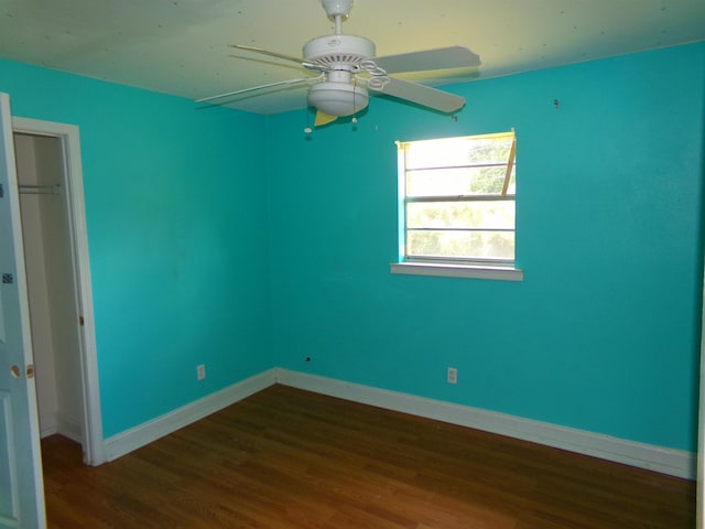 402 W Brent St, Chattahoochee, FL 32324 - unfurnished bedroom featuring dark wood-style flooring, a closet, and a ceiling fan