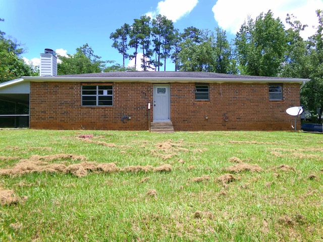 402 W Brent St, Chattahoochee, FL 32324 - single story home featuring entry steps, a chimney, a front lawn, and brick siding