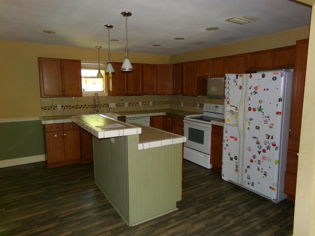 402 W Brent St, Chattahoochee, FL 32324 - kitchen featuring tile countertops, white appliances, backsplash, and dark wood finished floors