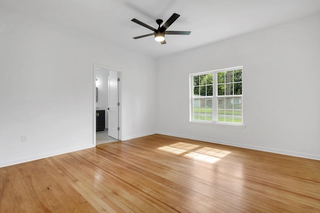 spare room with ceiling fan and light hardwood / wood-style flooring