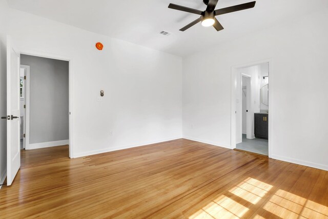 502 N 11th St, Quincy, FL 32351 - spare room featuring ceiling fan, light wood finished floors, and baseboards