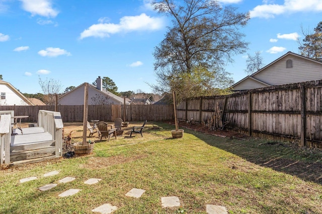 view of yard with an outdoor fire pit