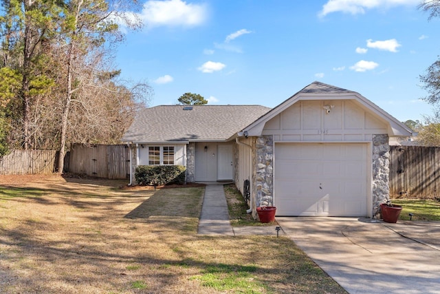 single story home with a garage and a front lawn