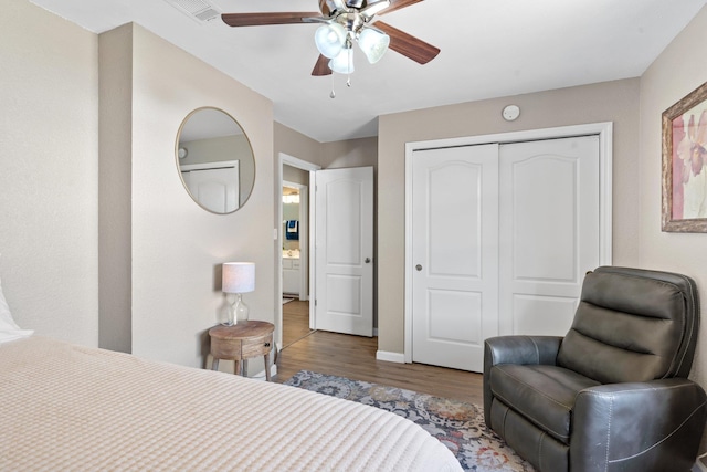 bedroom featuring ceiling fan, hardwood / wood-style floors, and a closet