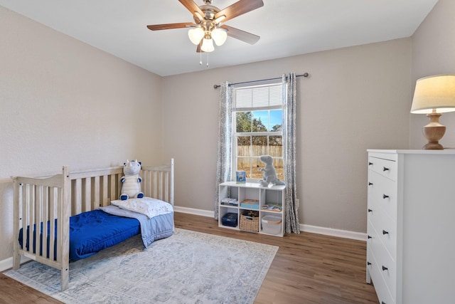 bedroom with hardwood / wood-style flooring and ceiling fan