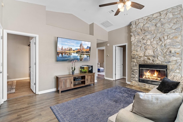 living room with a fireplace, high vaulted ceiling, dark hardwood / wood-style floors, and ceiling fan