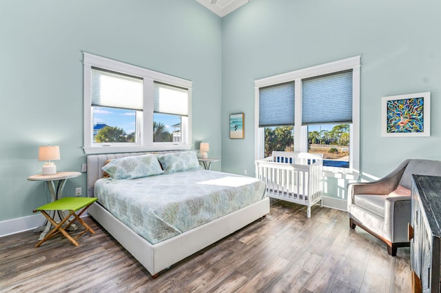 bedroom with hardwood / wood-style flooring