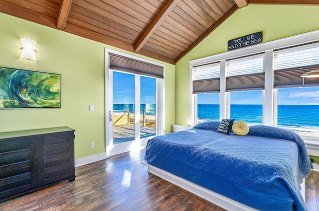 bedroom featuring access to exterior, vaulted ceiling with beams, dark hardwood / wood-style flooring, and a water view