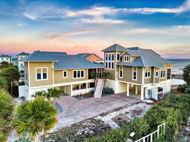 beach home with a water view and a carport