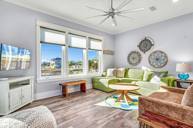 living room with ceiling fan, light hardwood / wood-style flooring, and crown molding