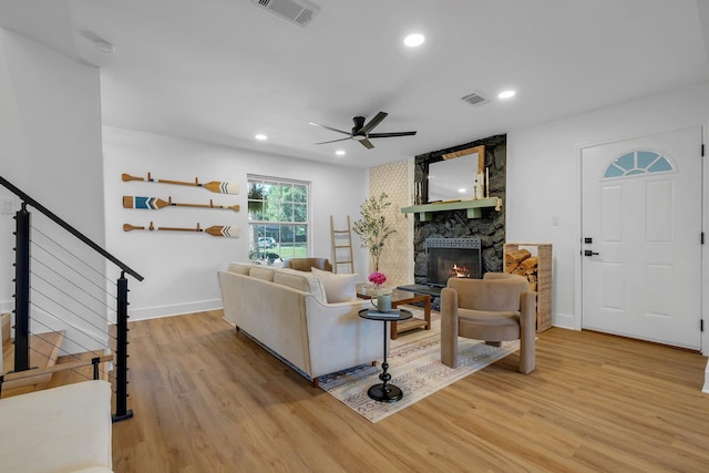 246 Intrepid Ct, Tallahassee, FL 32312 - living area featuring light wood-style floors, a fireplace, a ceiling fan, recessed lighting, and baseboards