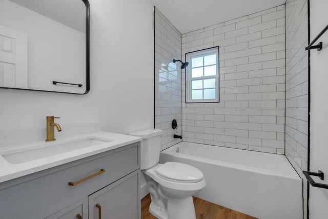 246 Intrepid Ct, Tallahassee, FL 32312 - full bathroom featuring wood finished floors, vanity, toilet, and shower / washtub combination