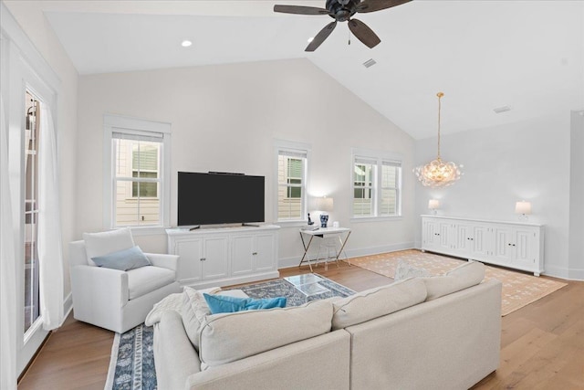 190 Camellia Oaks Ave Unit 96, Tallahassee, FL 32317 - living area with light wood-type flooring, ceiling fan, a chandelier, high vaulted ceiling, and baseboards