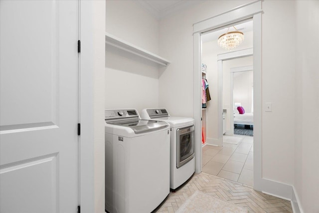 190 Camellia Oaks Ave Unit 96, Tallahassee, FL 32317 - washroom featuring washer and clothes dryer, ornamental molding, a chandelier, and baseboards