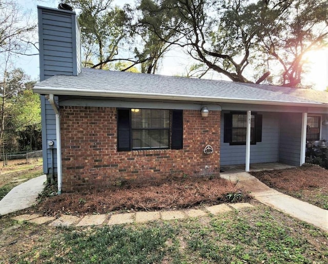 2585 Panther Creek Rd, Tallahassee, FL 32308 - single story home with a chimney, brick siding, and roof with shingles
