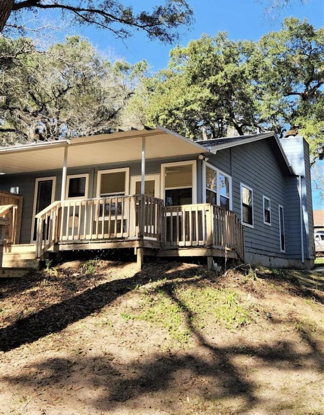 2585 Panther Creek Rd, Tallahassee, FL 32308 - back of house featuring a chimney and a wooden deck