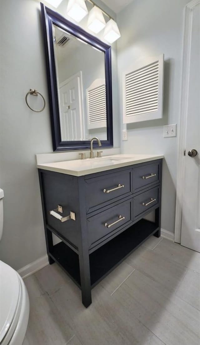 2585 Panther Creek Rd, Tallahassee, FL 32308 - half bathroom featuring vanity and wood finished floors