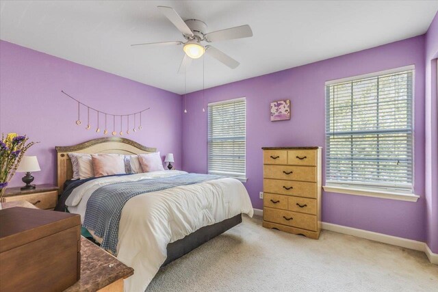 4270 Avon Park Cir, Tallahassee, FL 32311 - bedroom featuring light colored carpet, a closet, a ceiling fan, and baseboards