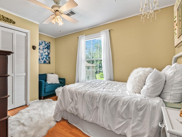 3104 Oak Hammock Ln Unit U, Tallahassee, FL 32301 - bedroom featuring wood finished floors, crown molding, a closet, and a ceiling fan