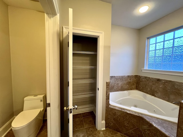 2541 Lagrange Trl, Tallahassee, FL 32312 - full bathroom with toilet, tile patterned flooring, and a tub with jets