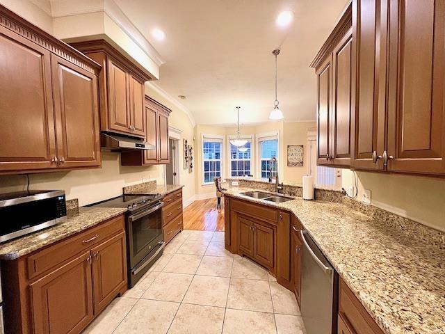 2541 Lagrange Trl, Tallahassee, FL 32312 - kitchen with stainless steel appliances, a sink, under cabinet range hood, light tile patterned flooring, and light stone countertops