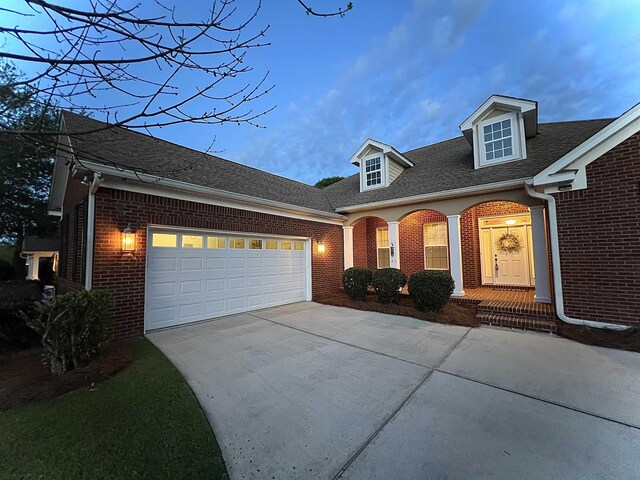 2541 Lagrange Trl, Tallahassee, FL 32312 - view of front of home with brick siding, concrete driveway, a garage, and roof with shingles