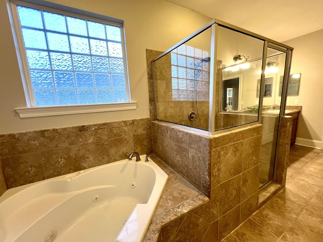 2541 Lagrange Trl, Tallahassee, FL 32312 - full bathroom with a tub with jets, tiled shower, vanity, and tile patterned flooring